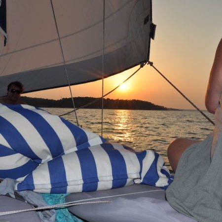 Sunset sailing on a yacht in Halkidiki with cushions on deck